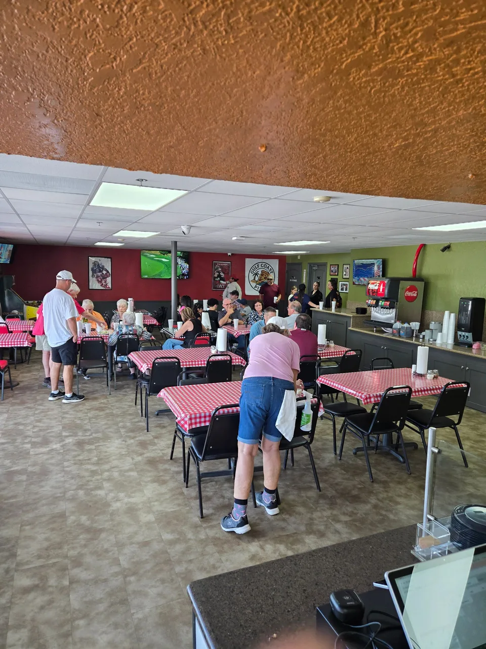 Guests in the dining room at Gulf Coast Pizza